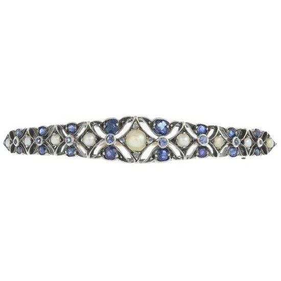 An early 20th century silver and gold, sapphire, split