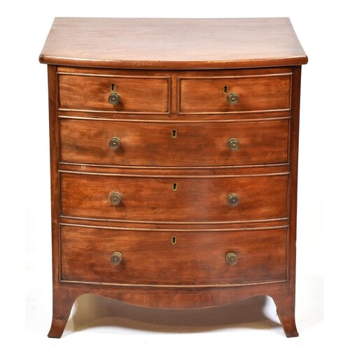 An early Victorian bow fronted mahogany commode chest, with ...