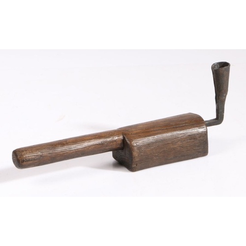 An oak and wrought-iron hand-held socket candlestick The s...