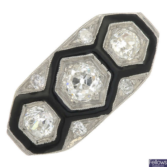 An old-cut diamond and black enamel three-stone ring.