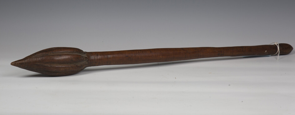 An unusual 19th century Oceanic hardwood war type throwing club with fluted carved bulbous pointed h