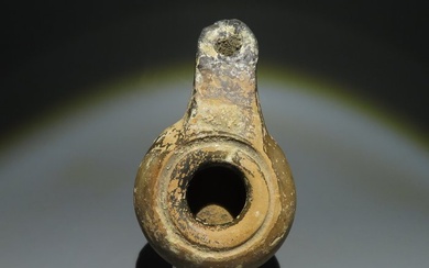 Ancient Greek Terracotta Oil Lamp. 3rd-2nd century BC. 10.5 cm length.