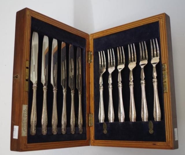 Cased set 6 fruit knives & forks each with silver plate hand...