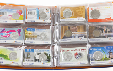 Collection coins and medals in coincards in special album