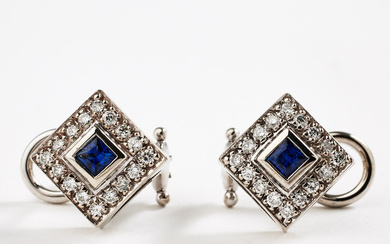 EARRINGS, 1 pair, 14k white gold, each earring with 1 carrécut sapphire, total 0,28 ct, encrusted by 32 brilliant cut diamonds, total 0,32 ct.