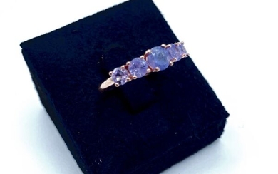 Exquisite 925/1000 pink vermeil headband ring paved with 5 round tanzanites including a larger central one.