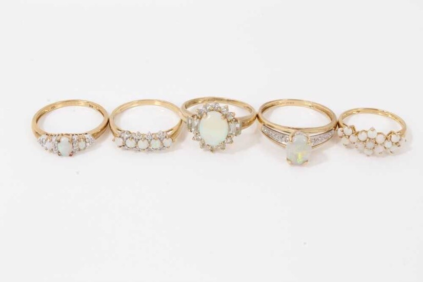 Five 9ct gold opal rings