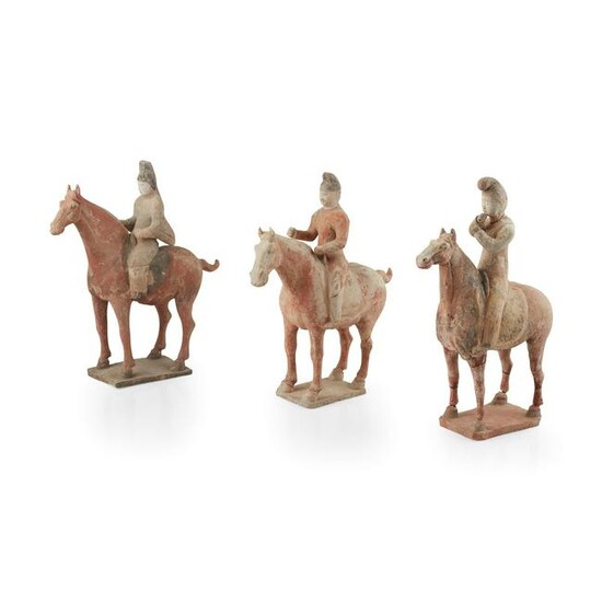 GROUP OF THREE PAINTED POTTERY HORSES AND RIDERS TANG