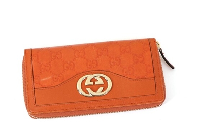 NOT SOLD. Gucci: A "Logo Zip-Around" wallet of orange guccissima leather with gold-tone GG logo,...