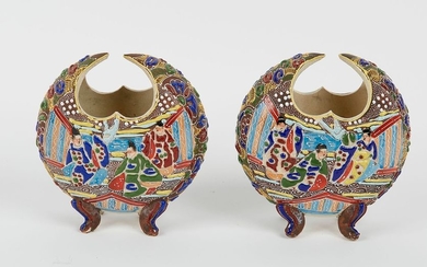 JAPAN. Pair of crescent-shaped vases with polychrome decoration...