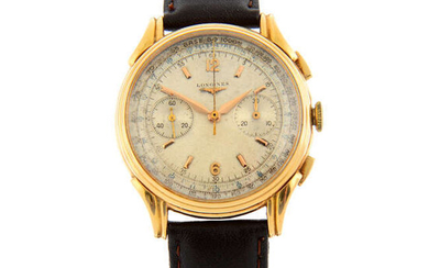 LONGINES - a yellow metal chronograph wrist watch, 37mm.