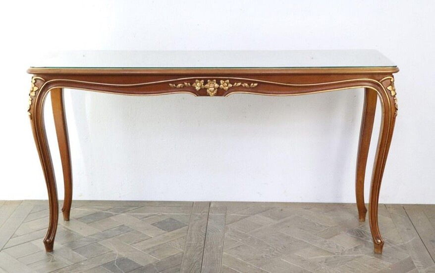 Narrow console in carved and molded wood, partially gilded, the top painted with a gold cartouche.