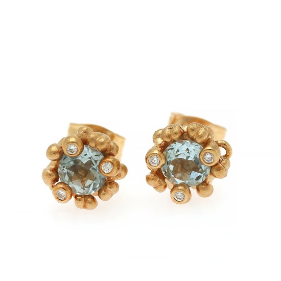 Ole Lynggaard: A pair of “Flower Basket” diamond and aquamarine ear studs each set with an aquamarine and three diamonds, mounted in 18k gold. (2)