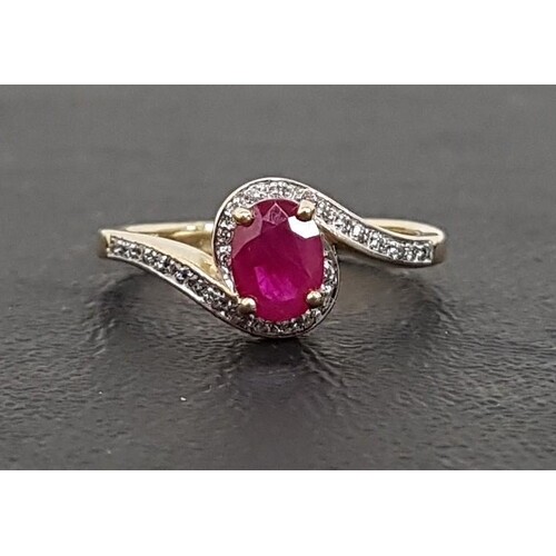 RUBY AND DIAMOND RING the central oval cut ruby approximatel...