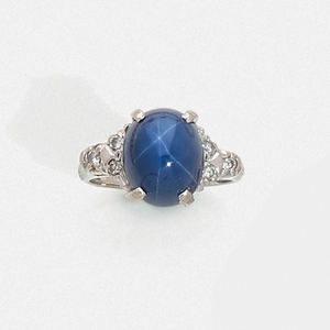 SAPPHIRE RING A cabochon star sapphire, diamond and...