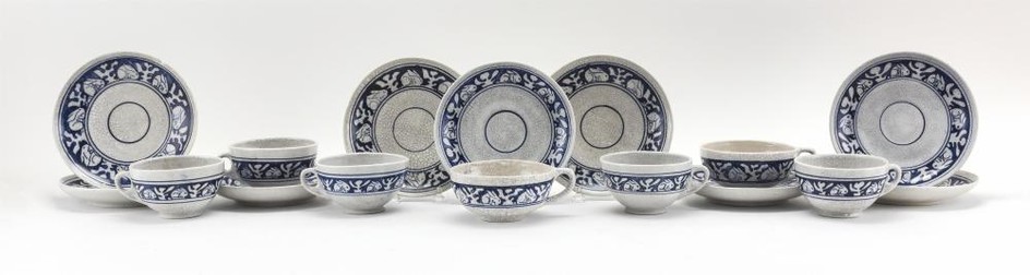 SEVEN DEDHAM POTTERY CUPS AND NINE SAUCERS In Rabbit pattern. Saucer diameters 6.25".