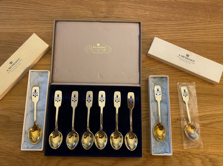 NOT SOLD. Set of nine gilded sterling silver spoons with enamel. Manufactured by A. Michelsen....