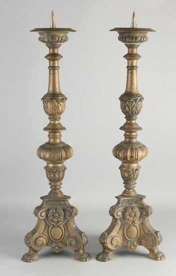 Two large bronze candlesticks in Baroque style.&#160