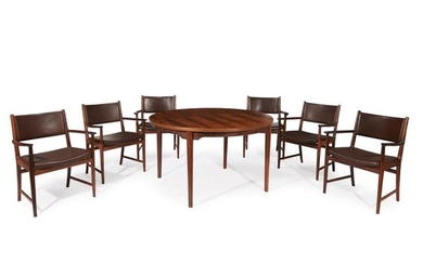 A Scandinavian rosewood dining table and set of six...