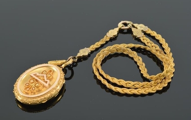 19th century Etruscan Revival 18 kt gold locket. Oval