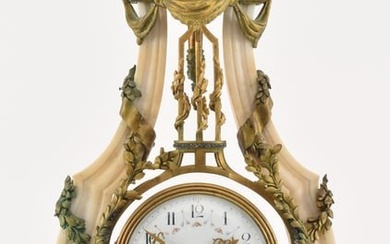 19th century French marble and gilt bronze clock. Unusual high hanging pendulum surrounding the
