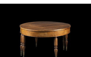A walnut rounded centre table. 19th century (d. cm 130 x h. cm 78)