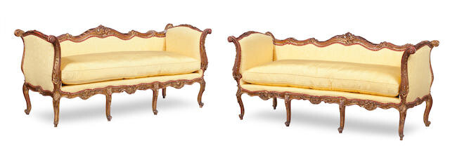 A pair of 19th century style carved giltwood and gesso sofas, 20th century