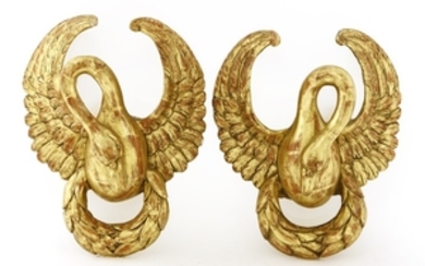 A pair of carved giltwood wall brackets