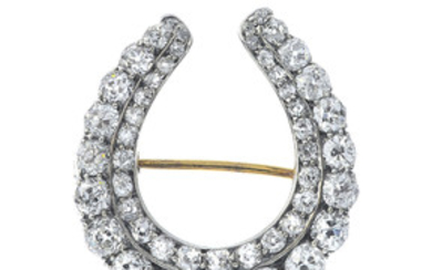 A late Victorian silver and 9ct gold diamond horseshoe brooch. View more details