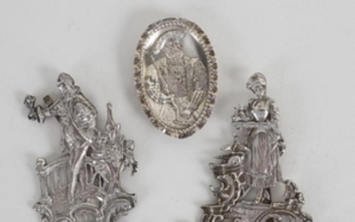 A pair of white metal figures, gallant with companion