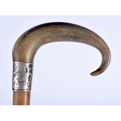 A 19TH CENTURY MIDDLE EASTERN CARVED RHINOCEROS HORN WALKING...