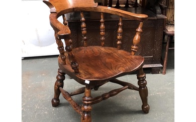 A 19th century ash and elm smokers bow armchair, on heavily ...
