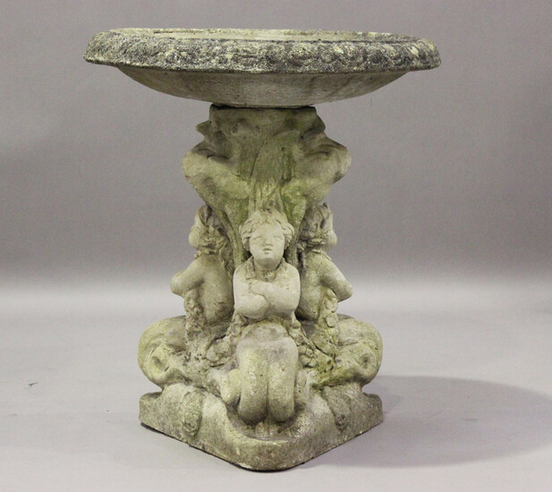 A 20th century cast composition stone garden bird bath, the circular bowl raised on a triform base m