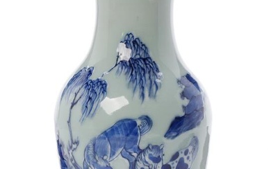 A Chinese baluster vase decorated in blue with horses on light celadon...