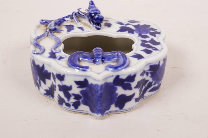 A Chinese blue and white porcelain ink pot with applied drag...