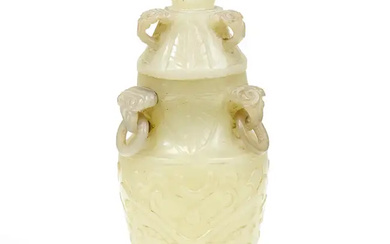 A Chinese celadon jade 'taotie' vase and cover Qing dynasty, 19th century...
