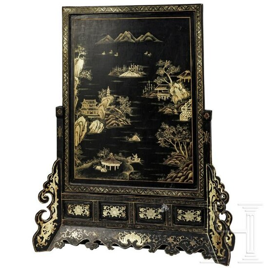 A Chinese lacquered and gilt-decorated table screen