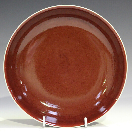 A Chinese sang-de-boeuf glazed porcelain saucer dish, mark of Qianlong but probably 20th century or