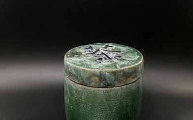 A Chinese shiwan ceramic tea container.