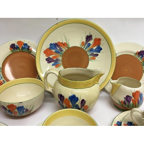 A Clarice Cliff tea set in the crocus pattern comprising six...