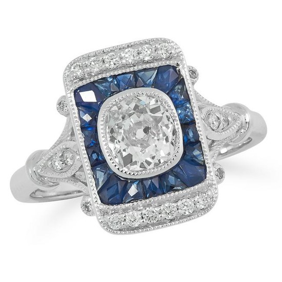 A DIAMOND AND SAPPHIRE DRESS RING set with a central