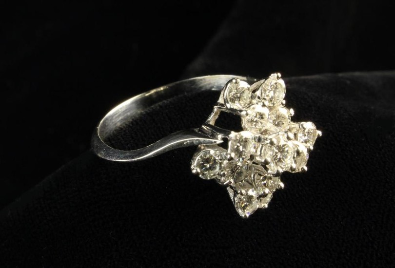 A Diamond & White Gold Dress Ring set with 13 brilliant cut stones totalling 1.3 carat weight in an