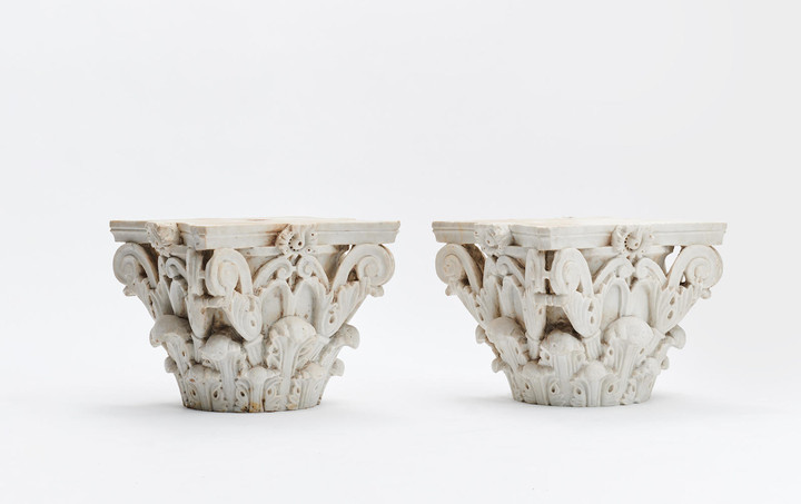 A FINE PAIR OF ITALIAN CARVED MARBLE CORINTHIAN CAPITALS
