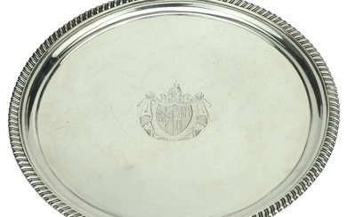 A George III silver salver, with gadrooned border, on three gadroon-edged feet,...