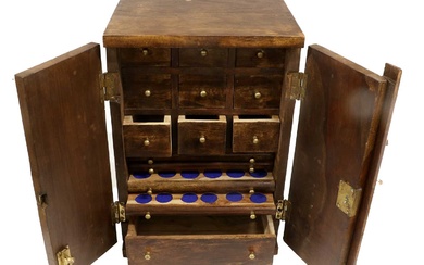 A Hardwood Collectors Cabinet, comprising, 9x storage drawers, 5x coin...