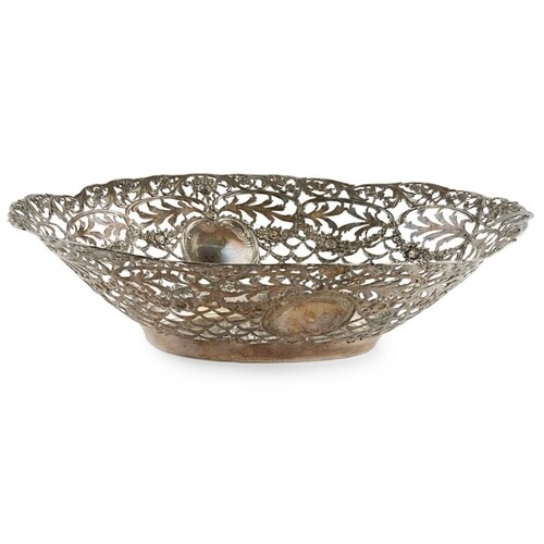 A LARGE CONTINENTAL OVAL SILVER BREAD BASKET Having pierced...