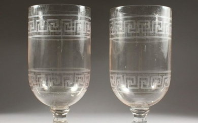 A LARGE PAIR OF GLASS URNS, with key pattern