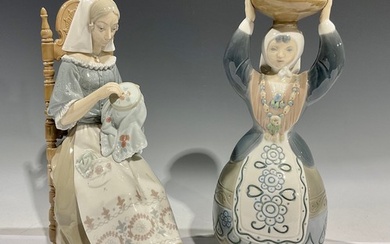 A Lladro porcelain figure, The Embroider, 28.5cm high; anoth...
