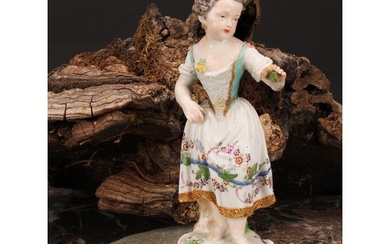 A Meissen porcelain figure, of a girl wearing a floral dress...