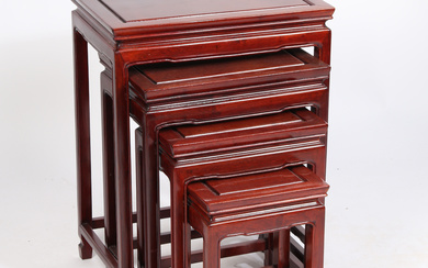 A NEST OF FOUR CHINESE HARDWOOD OCCASIONAL TABLES.